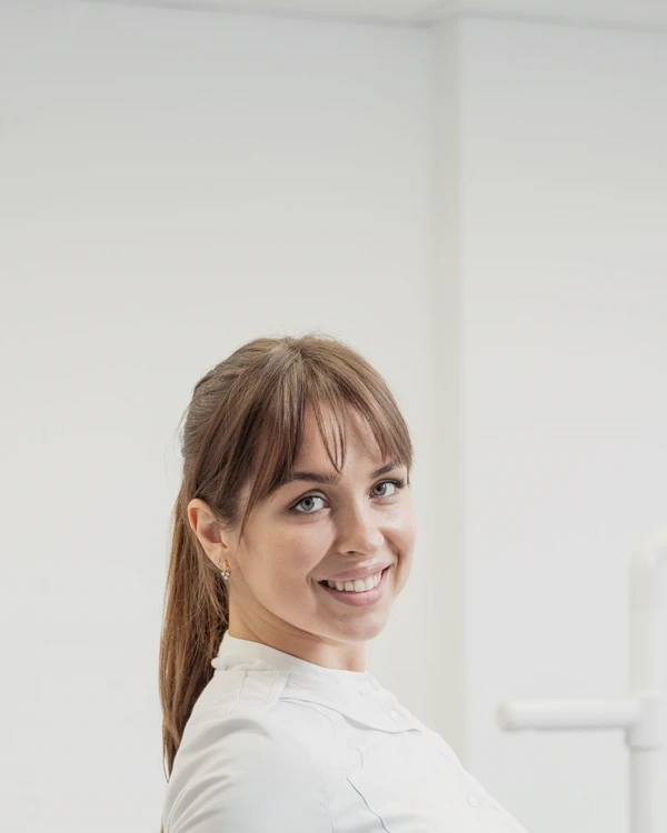 Portrait of Dr. Marisa Elwood in a clinical coat