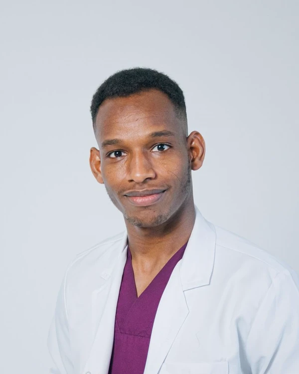 Portrait of Dr. Aaron Petrisko in a clinical coat